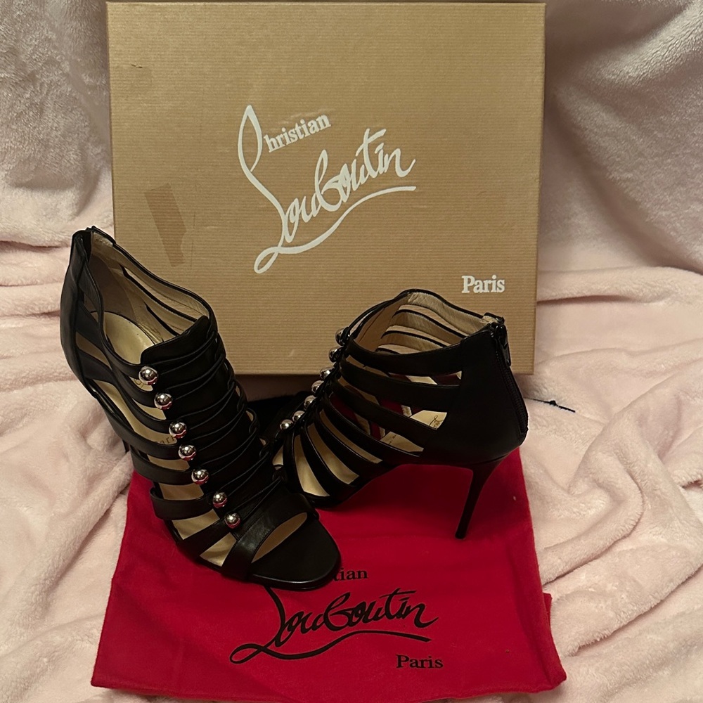 Christian Louboutin Black Strappy Heel Sandals with Red Soles and Silver Accents